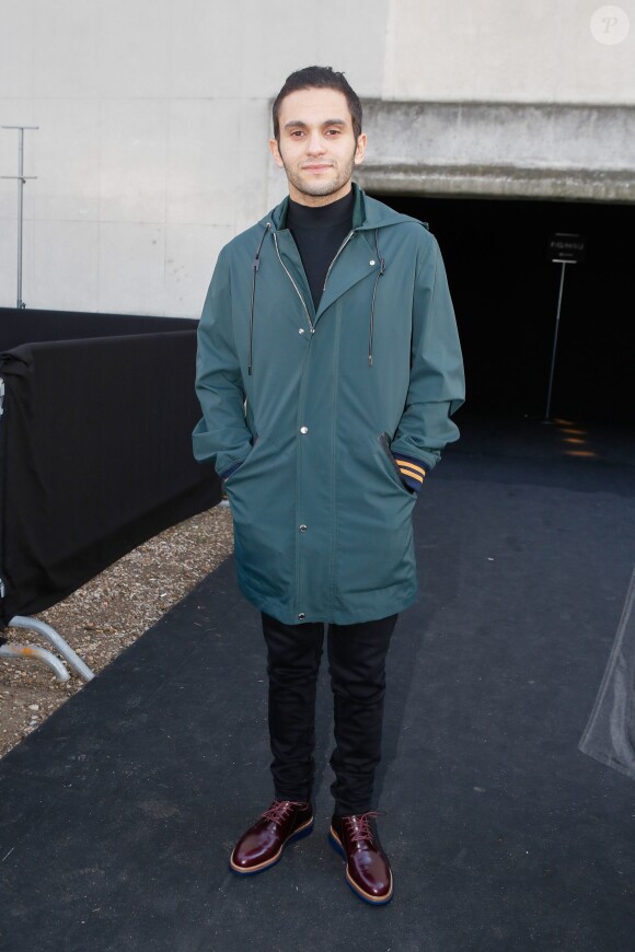 Malik Bentalha au défilé de mode hommes Dior collection prêt-à-porter Automne Hiver 2015/2016 au Tennis Club de Paris le 24 janvier 2015.