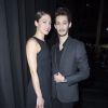 Pierre Niney et sa compagne Natasha Andrews au défilé de mode hommes Dior collection prêt-à-porter Automne Hiver 2015/2016 au Tennis Club de Paris le 24 janvier 2015.