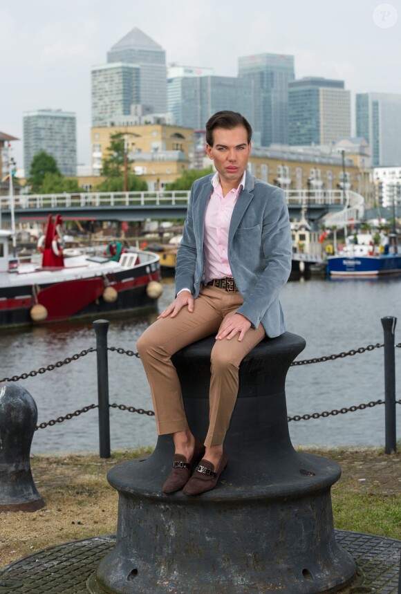 Brazilian-born Rodrigo Alves, 30, a trans-Atlantic flight attendant from London, UK who has spent over 120,000 euros on cosmetic surgery and treatments. A real life Ken Doll who has spent 120,000 euros on plastic surgery has vowed to go under the knife again - even though his obsession nearly killed him. Perfectionist Rodrigo Alves, 30, has splashed the cash on 12 operations since the age of 20, including nose jobs, liposuction, six-pack operations, calf shaping, pec implants, Botox fillers, and more. But Rodrigo's quest for perfection nearly cost him his life in January this year when a Brazilian doctor injected a gel into his arms to make them look more muscular. The flight attendant was struck down by a major infection which left him paralysed and unable to feed or wash himself. Photo by SWNS/ABACAPRESS.COM30/04/2014 - London