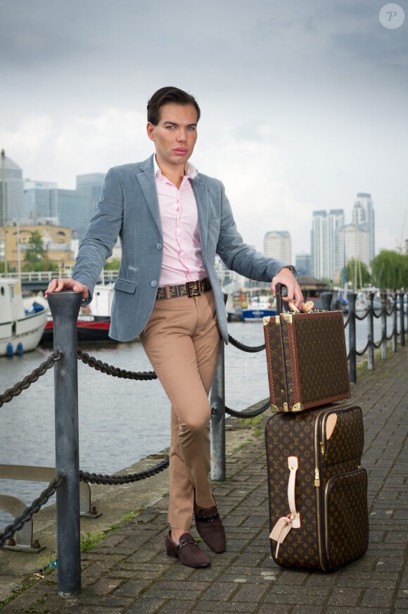Brazilian-born Rodrigo Alves, 30, a trans-Atlantic flight attendant from London, UK who has spent over 120,000 euros on cosmetic surgery and treatments. A real life Ken Doll who has spent 120,000 euros on plastic surgery has vowed to go under the knife again - even though his obsession nearly killed him. Perfectionist Rodrigo Alves, 30, has splashed the cash on 12 operations since the age of 20, including nose jobs, liposuction, six-pack operations, calf shaping, pec implants, Botox fillers, and more. But Rodrigo's quest for perfection nearly cost him his life in January this year when a Brazilian doctor injected a gel into his arms to make them look more muscular. The flight attendant was struck down by a major infection which left him paralysed and unable to feed or wash himself. Photo by SWNS/ABACAPRESS.COM30/04/2014 - London