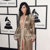 Kim Kardashian, habillée d'une robe haute couture Jean Paul Gaultier et de sandales Tom Ford, assiste aux 57e Grammy Awards au Staples Center. Los Angeles, le 8 février 2015.