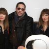 JoeyStarr entre Les Brigittes (Sylvie Hoarau et Aurélie Saada) lors du Lancement de l'enceinte "Phantom", Implosive Sound Center, créée par Devialet, et rencontre avec les fondateurs de la marque, chez Colette à Paris, le 16 février 2015.