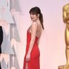 Dakota Johnson (en Saint Laurent) - 87e cérémonie des Oscars à Hollywood, le 22 février 2015.