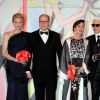 La princesse Charlene de Monaco, le prince Albert II de Monaco, la princesse Caroline de Hanovre et Karl Lagerfeld arrivant au Bal de la Rose 2014, sur le thème du constructivisme russe, au Sporting de Monte-Carlo le 29 mars 2014.