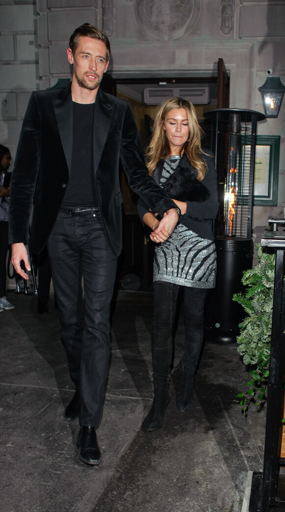 Abbey Clancy et son mari Peter Crouch lors de la soirée de Noël organisée par le "Love Magazine" au Chiltern Firehouse de Londres, le 15 décembre 2014