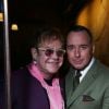 Elton John et son mari David Furnish lors de la Fashion Week Homme à Londres, le 7 janvier 2014