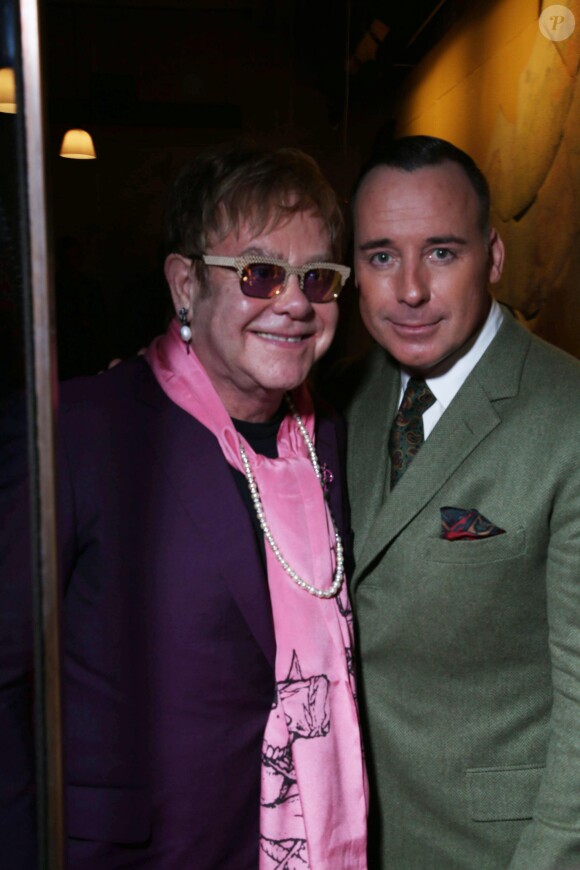 Elton John et son mari David Furnish lors de la Fashion Week Homme à Londres, le 7 janvier 2014