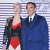 Nikos Aliagas et sa compagne Tina Grigoriou - Photocall de la soirée de vernissage de l'exposition "Jean Paul Gaultier" au Grand Palais à Paris, le 30 mars 2015.