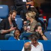 Flavie Flament et son compagnon lors du concert de Paul McCartney au Stade de France le 11 juin 2015 à Saint-Denis