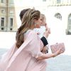 La princesse Madeleine de Suède, enceinte, son mari Christopher O'Neill et leur fille la princesse Leonore de Suède au mariage du prince Carl Philip de Suède et Sofia Hellqvist à la chapelle du palais royal à Stockholm, le 13 juin 2015.