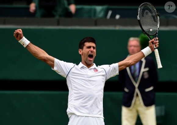 Novak Djokovic celebrates beating Roger Federer in the Mens Singles Final on day Thirteen of the Wimbledon Championships at the All England Lawn Tennis and Croquet Club in Wimbledon, UK on July 12, 2015. Photo by Dominic Lipinski/PA Wire/ABACAPRESS.COM12/07/2015 - London