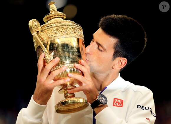 Novak Djokovic lifts the Wimbledon Trophy as he celebrates winning the Men's Single's Final during day Thirteen of the Wimbledon Championships at the All England Lawn Tennis and Croquet Club in Wimbledon, London, UK on July 12, 2015. Photo by Mike Egerton/PA Wire/ABACAPRESS.COM12/07/2015 - London