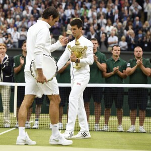 Novak Djokovic of Serbia with the trophy after he wins the men final against Roger Federer of SWISS at the Wimbledon Championships in London, Great Britain on JULY, 12, 2015. Photo by Corinne Dubreuil/ABACAPRESS.COM12/07/2015 - London