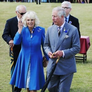 Le prince Charles et la duchesse Camilla en visite au salon floral de Sandringham le 29 juillet 2015