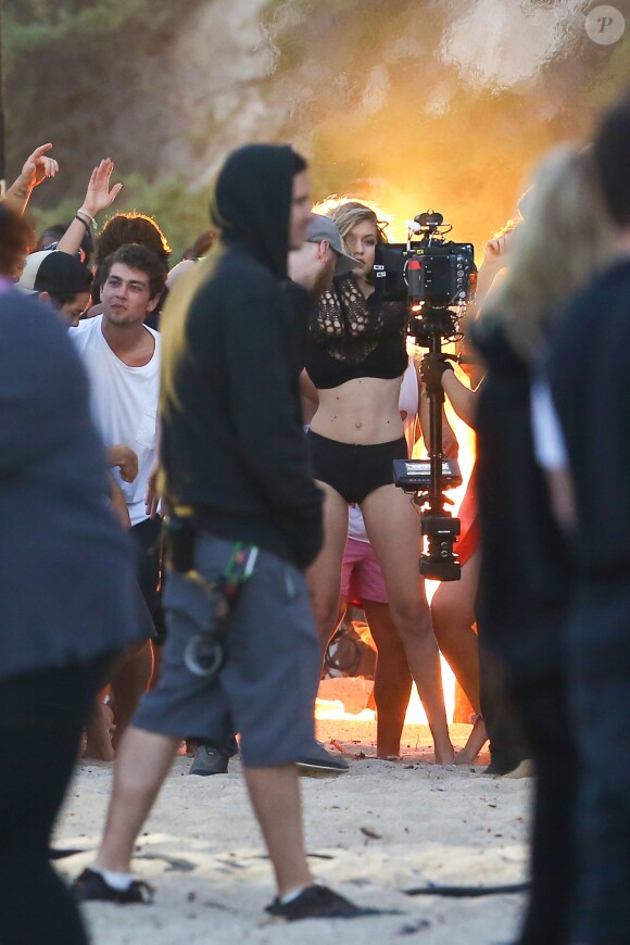 Gigi Hadid films a music video on the beach in Malibu for one of Calvin Harris's new songs. The lovely young fashion model wore a black two piece bathing suit as she danced about and posed for the cameras during the shoot with dozens of extras surrounding her. Los Angeles, CA, USA, June 25, 2015. Photo by GSI/ABACAPRESS.COM26/06/2015 - Los Angeles
