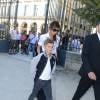 Promenade au jardin des Tuileries avec sa mère, après avoir fait du shopping chez Chanel, Romeo est habillé d'une veste teddy, d'un tee shirt blanc, d'un jean, et de baskets blanches, le 23 juillet 2012 à Paris