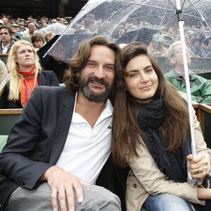 Frédéric Beigbeder et sa compagne Lara lors des internationaux de France de Rolang Garros à Paris, le 10 juin 2012