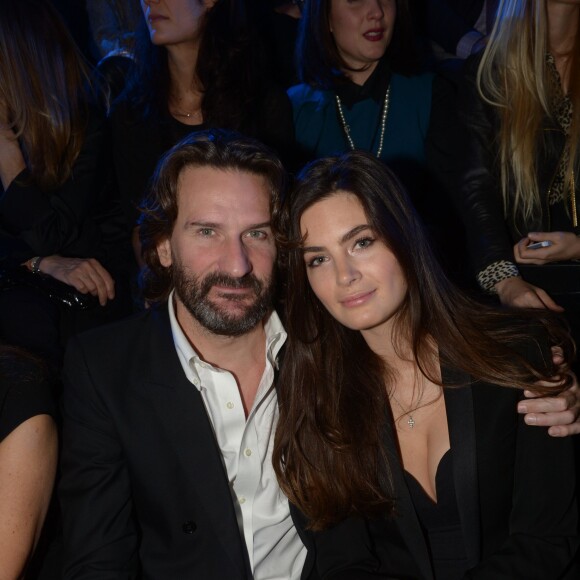Frédéric Beigbeder et sa fiancée Lara Micheli - People au défilé de la collection Natalia pour Etam à la Bourse du Commerce à Paris, le 25 février 2014.  