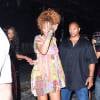 Rihanna se cache le visage en quittant le club "Opus Lounge" à New York, habillée d'une robe Jeremy Scott (collection printemps-été 2015) et de sandales Pierre Hardy (modèle Majorelle). Le 29 août 2015.