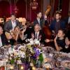 Le groupe The Gypsy Queens à la table de Mélanie Laurent, Sidney Toledano et Ana Girardot lors du 18e Grand Bal de Deauville, au profit de l'association Care France. Deauville, le 29 août 2015.