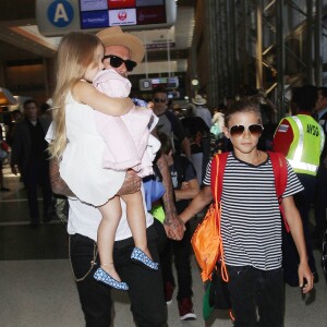 David Beckham, sa femme Victoria et leurs enfants Brooklyn, Romeo, Cruz et Harper prennent un vol à l'aéroport de Los Angeles, le 31 août 2015.