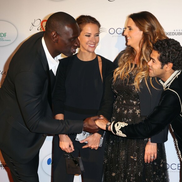 Omar Sy, Mélissa Theuriau, Hélène Sy et Jamel Debbouze au gala "Par Coeur" pour les 10 ans de l'association "Cekedubonheur" au pavillon d'Armenonville à Paris. Le 24 septembre 2015