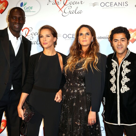 Omar Sy, Mélissa Theuriau, Hélène Sy et Jamel Debbouze au gala "Par Coeur" pour les 10 ans de l'association "Cekedubonheur" au pavillon d'Armenonville à Paris. Le 24 septembre 2015