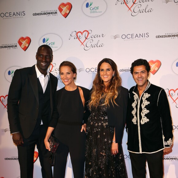 Omar Sy, Mélissa Theuriau, Hélène Sy et Jamel Debbouze au gala "Par Coeur" pour les 10 ans de l'association "Cekedubonheur" au pavillon d'Armenonville à Paris. Le 24 septembre 2015