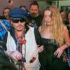 Johnny Depp et sa femme Amber Heard à la sortie du festival Rock in Rio au Brésil, le 24 septembre 2015