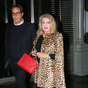 Catherine Deneuve et Gilles Dufour - People au défilé de mode "Saint Laurent", collection prêt-à-porter printemps-été 2016, à Carreau du Temple à Paris. Le 5 Octobre 2015