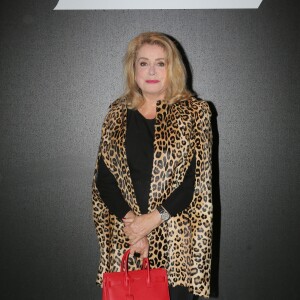 Catherine Deneuve et Gilles Dufour - People au défilé de mode "Saint Laurent", collection prêt-à-porter printemps-été 2016, à Carreau du Temple à Paris. Le 5 Octobre 2015