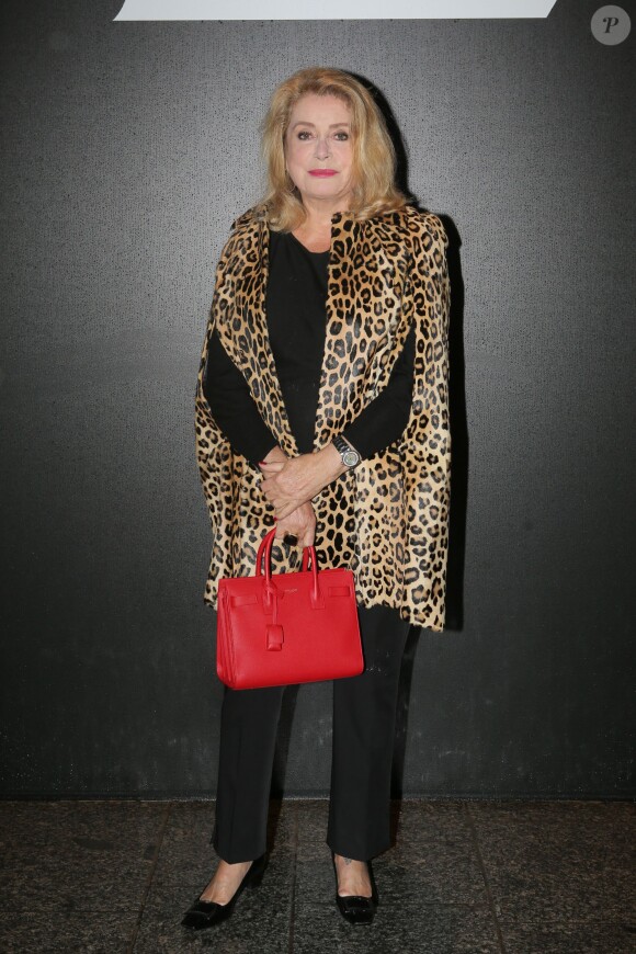 Catherine Deneuve et Gilles Dufour - People au défilé de mode "Saint Laurent", collection prêt-à-porter printemps-été 2016, à Carreau du Temple à Paris. Le 5 Octobre 2015