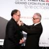 John Lasseter et Thierry Frémaux - Soirée d'ouverture de la 7e édition du Festival Lumière 2015 à la Halle Tony-Garnier à Lyon le 12 octobre 2015.