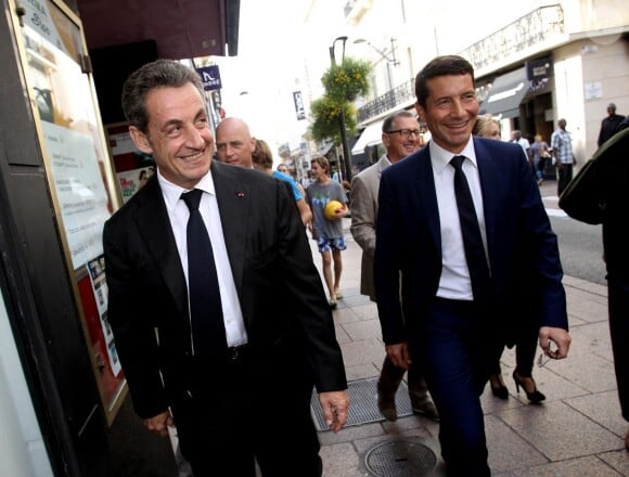 Nicolas Sarkozy, candidat à la présidence de l'UMP et le maire de Cannes David Lisnard lors de sa visite à Cannes, le 21 octobre 2014.