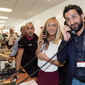 Cyril Hanouna et Enora Malagré  - 11e édition du "BGC Charity Day" à Paris le 11 septembre 2015 en mémoire aux 658 collaborateurs du groupe BGC partners (leader mondial du courtage interbancaire) disparus il y a 14 ans dans les attentats du World Trade Center le 11 septembre 2001.