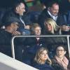 Yannick Noah, Isabelle Camus et leur fils Joalukas avaient le sourire lors du match de Ligue 1 PSG - Bastia lors de la 20e journée au Parc des Princes à Paris, le 8 janvier 2016