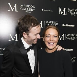 L'artiste photographe Tyler Shields et Lindsay Lohan assistent au vernissage de l'exposition "Decadence" à la Maddox Gallery. Londres, le 3 février 2016.