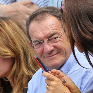 Jean-Pierre Pernaut et Nathalie Marquay - Jour 11 - People assistent au quart de finale entre Rafael Nadal et Stanislas Wawrinka lors des Internationaux de France de tennis a Roland-Garros le 5 juin 2013.