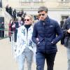 Olivia Palermo et son mari Johannes Huebl quittent le Grand Palais à l'issue du défilé Moncler Gamme Rouge. Olivia porte une veste, d'un pantalon et de baskets Moncler Gamme Rouge (collection printemps-été 2016). Paris, le 9 mars 2016.