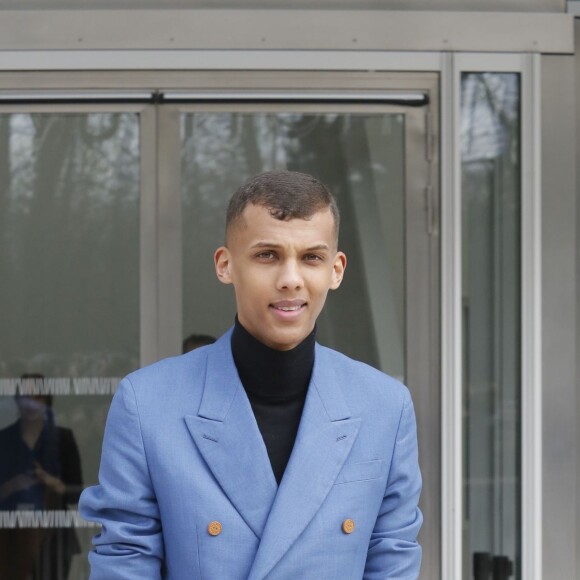 Stromae à la sortie du défilé de mode "Louis Vuitton", collection prêt-à-porter automne-hiver 2015/2016, à Paris. Le 11 mars 2015