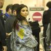 Kim Kardashian arrive à l'aéroport de LAX à Los Angeles pour prendre l’avion. Elle porte une veste en jean de la nouvelle collection de son mari Kanye West avec l'inscription 'Nazi tweeks rule'. Le 11 avril 2016