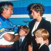 Lady Di et les princes William et Harry avec Flavio Briatore en juillet 1994 au Grand Prix de Silverstone.