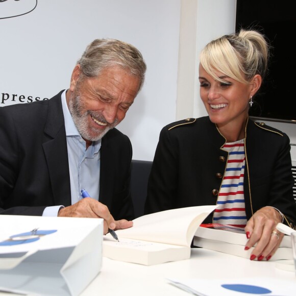 Exclusif - Jean-Claude Darmon et Laeticia Hallyday - Jean-Claude Darmon en dédicace de son livre "Au nom du foot" à la boutique "Colette" à Paris. Le 10 mai 2016. © Denis Guignebourg / Bestimage