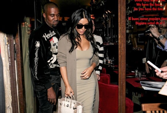 Kim Kardashian et Kanye West quittent le restaurant Ferdi. Paris, le 13 juin 2016.