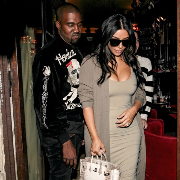 Kim Kardashian et Kanye West quittent le restaurant Ferdi. Paris, le 13 juin 2016.