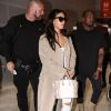 Kim Kardashian et Kanye West quittent Paris pour Los Angeles à l'aéroport de Roissy-Charles-de-Gaulle le 14 juin 2016.
