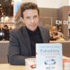 François-Xavier Ménage pour "Fukushima, le poison coule toujours" - Le "33ème Salon du Livre" au parc des expositions de la porte de Versailles à Paris, le 20 mars 2016. © Perusseau/Bestimage