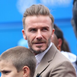 David Beckham et son fils Romeo assistent au match Murray vs Mahut au tournoi de tennis "Aegon Queens tennis Championship" à Londres le 14 juin 2016.