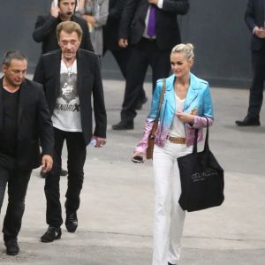 Exclusif - Johnny Hallyday et sa femme Laeticia quittent le concert de Céline Dion à l'AccorHotels Arena à Paris le 9 juillet 2016.