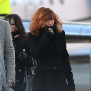 La chanteuse Mylene Farmer et son staff arrivent en jet prive a l'aeroport de Cannes-Mandelieu pour assister aux NRJ Music Awards le 25 Janvier 2013.